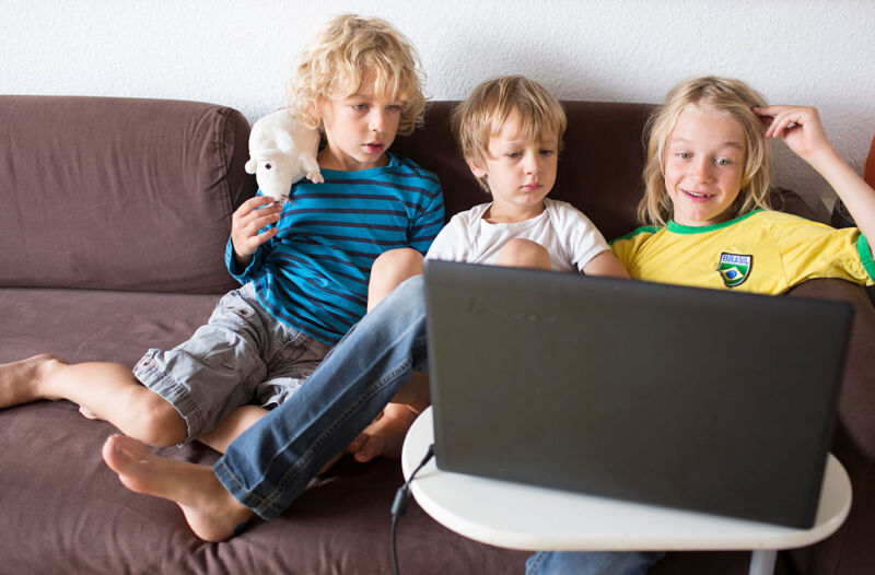 Kids looking at a laptop