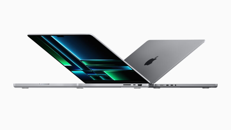 M2 MacBook Pro models, side by side, slightly open