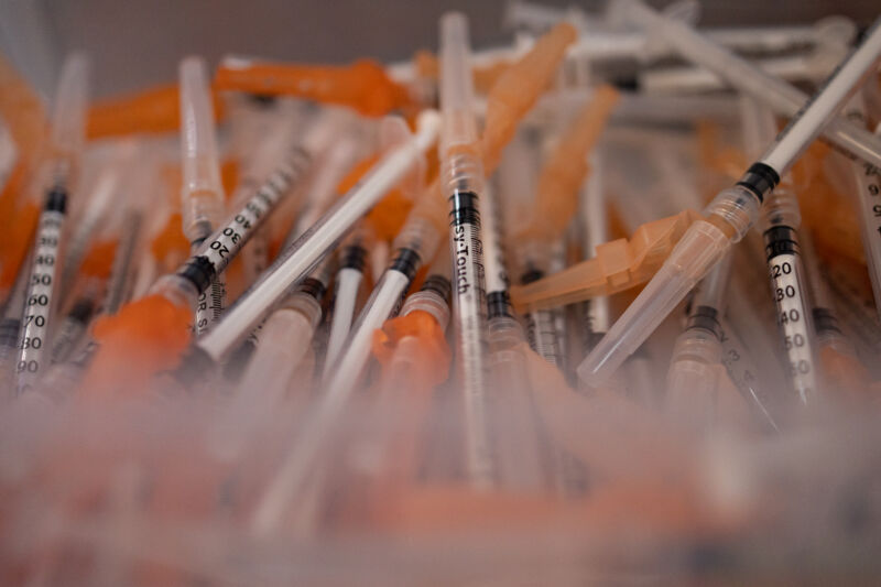 A container of syringes used to administer COVID-19 vaccine.