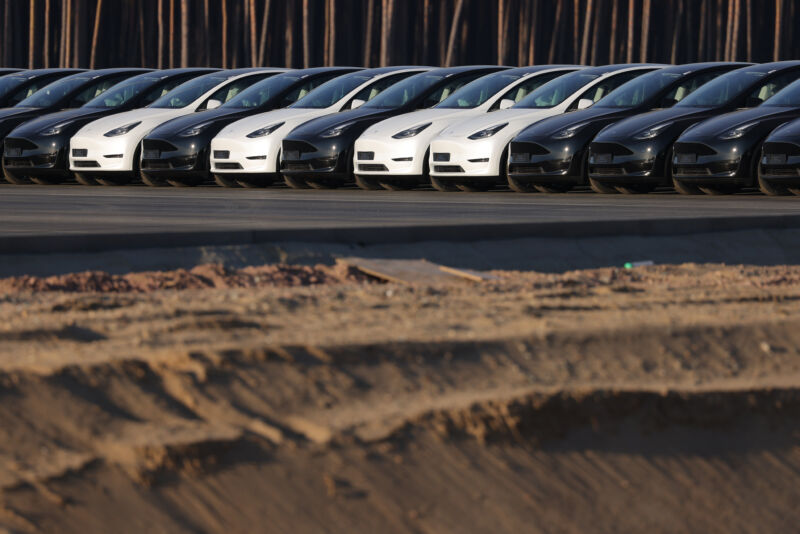 Newly completed Tesla Model Y electric cars stand at the new Tesla Gigafactory electric car manufacturing plant on March 21, 2022 near Gruenheide, Germany.