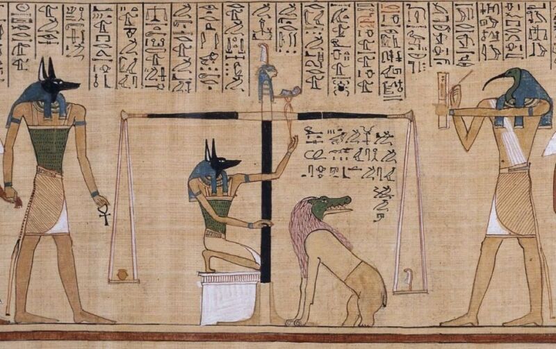 Exemplo de ilustração de um <em>Book of the Dead</em> Egyptian – not the newly discovered papyrus – depicting the ” weighing=”” of=”” the=”” heart.=””/><figcaption class=