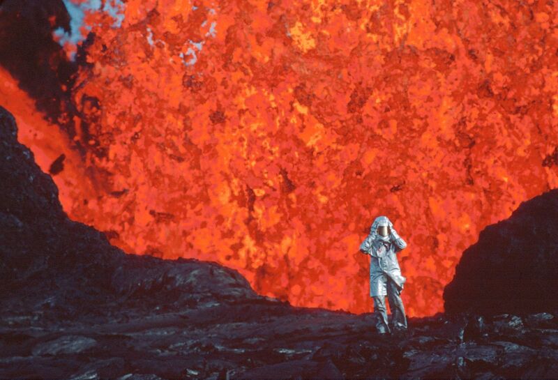 Vulcanologist Katia Krafft stands near a lava burst