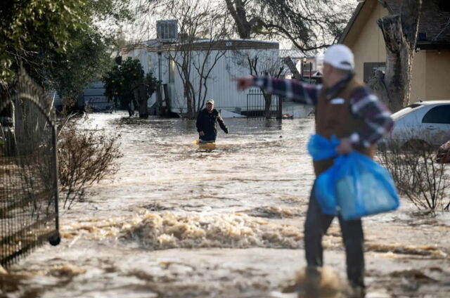 Residents scrambled to retrieve belongings as floodwaters rose in Merced, California, on January 10, 2023.
