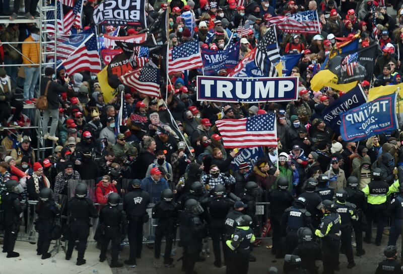 Police hold back a large group of Trump supporters on the day of the attack on the US Capitol.
