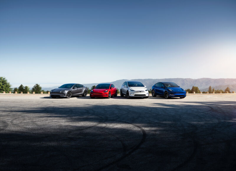 Four Teslas parked in a row