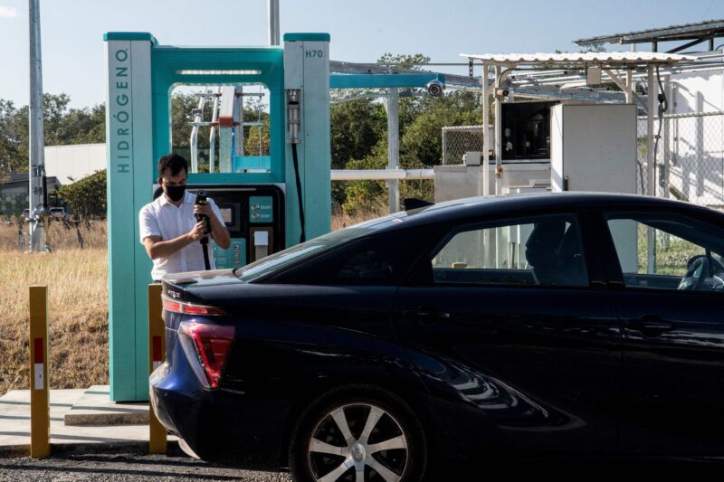 A man fills the tank of his car with hydrogen at a station of the Ad Astra Rocket Company in Guanacaste, Costa Rica
