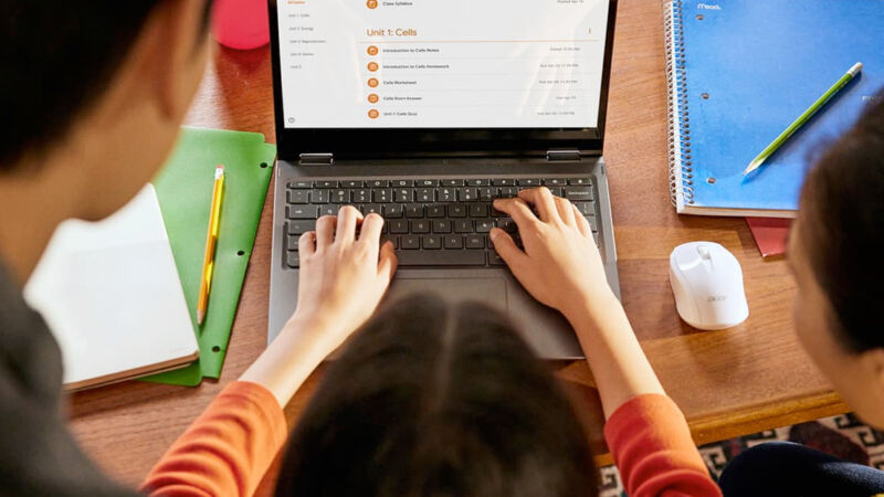 Child typing on a Chromebook