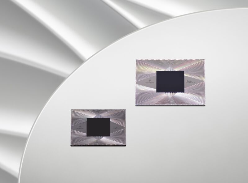 Image of two silver squares with dark squares embedded in them.