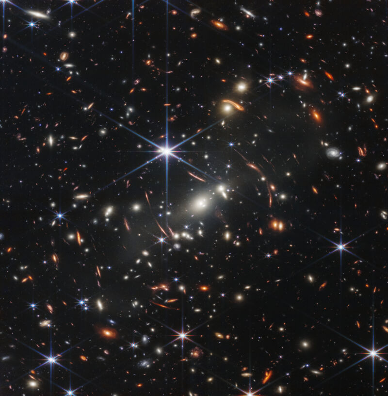 Image of distant galaxies, partly distorted by gravitational lensing.