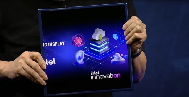 A Samsung Display exec demos sliding the screen of an Intel-based device at Intel Innovation Day in October.