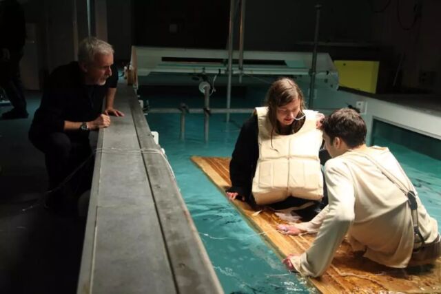 James Cameron supervises a cold and wet re-enactment of Jack and Rose on a makeshift raft.