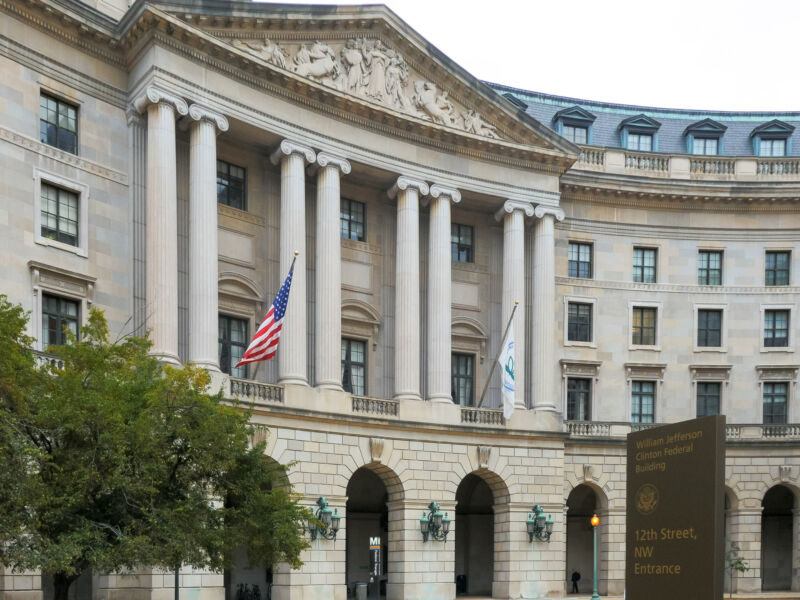 Image of a building with marble pillars.