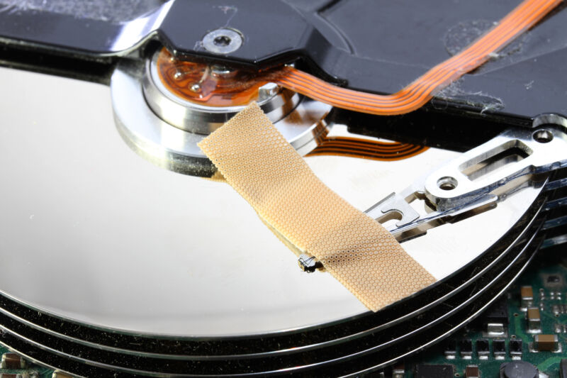 broken hard disk drive with a band-aid over your disks