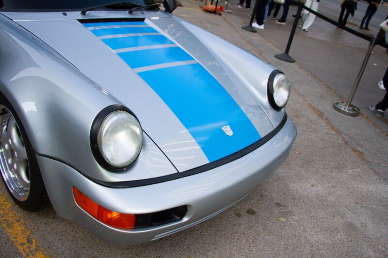 The front of a silver porsche 911