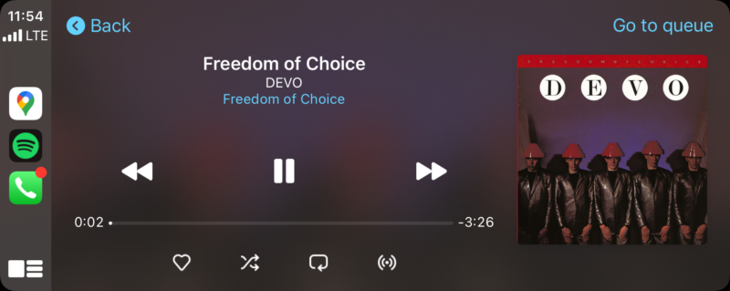 Apple CarPlay screenshot showing Devo's freedom of choice playing