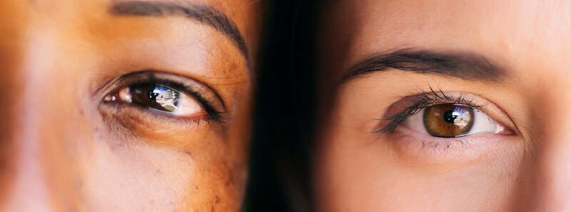 Image of two women's eyes.