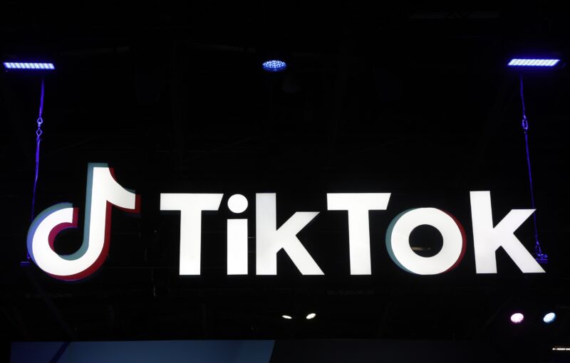 A large TikTok logo displayed at a game conference.