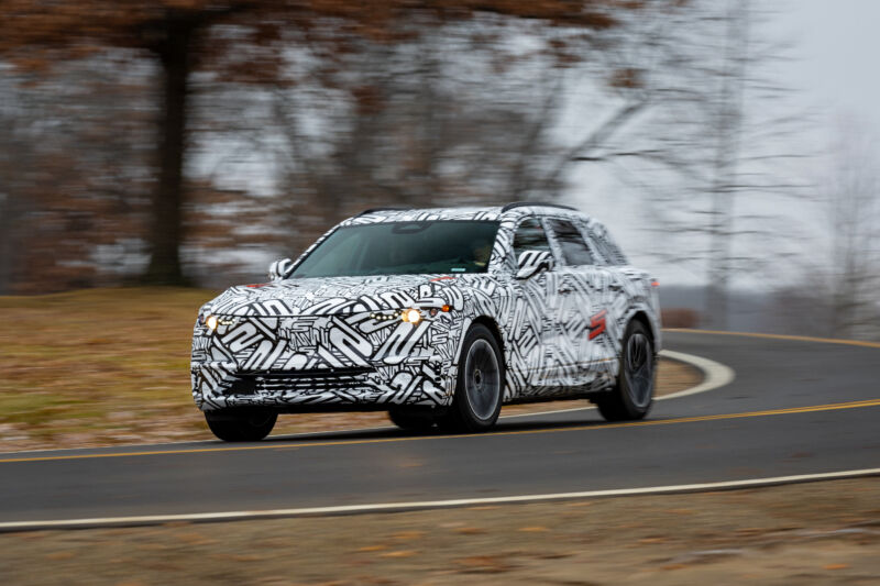 An Acura ZDX in camouflage wrap