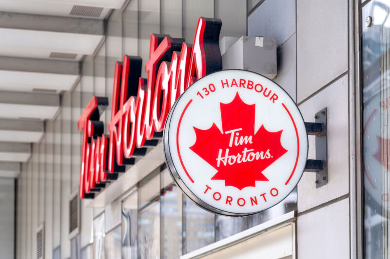 Tim Hortons sign with Canadian-flag-style maple leaf insignia