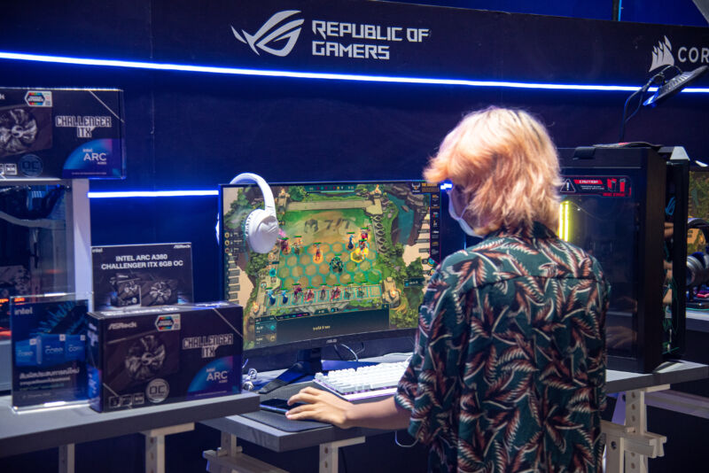 Someone playing games at a Republic of Gamers display