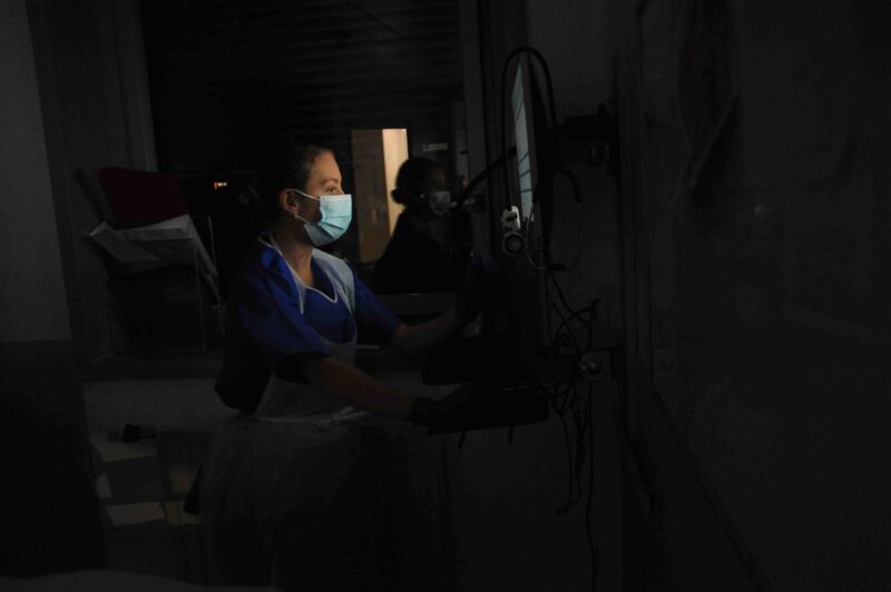 A health care worker in a medical intensive care unit.