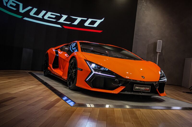 An orange Lamborghini Revuelto on display