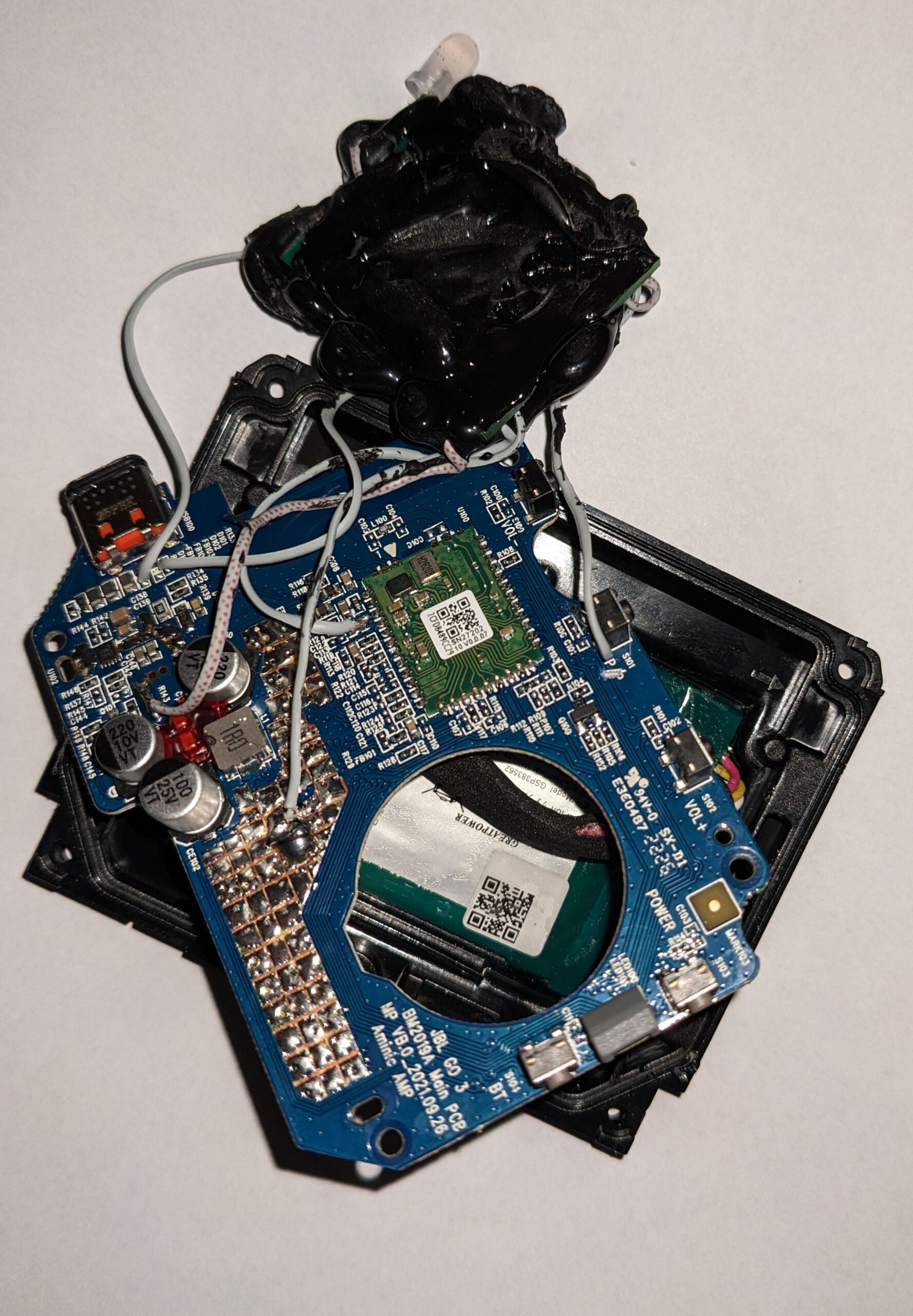 CAN injector chips attached to a resin globe glued to the JBL circuit board.