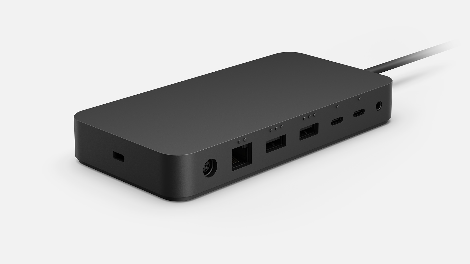 Microsoft puts one Thunderbolt 4 port and one USB-A port on the front; the power jack, Ethernet port, two more USB-A ports, two Thunderbolt 4 ports, and the headphone jack are on the back. There's also a lock slot on the right.