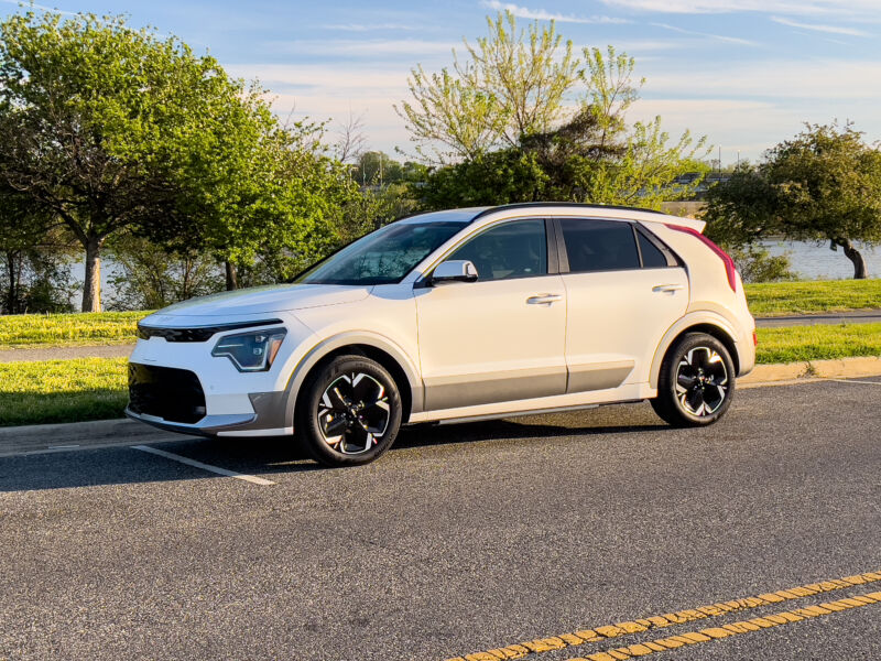 A Kia Niro EV parked by a river