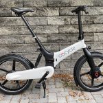 Image of a white foldable bicycle.