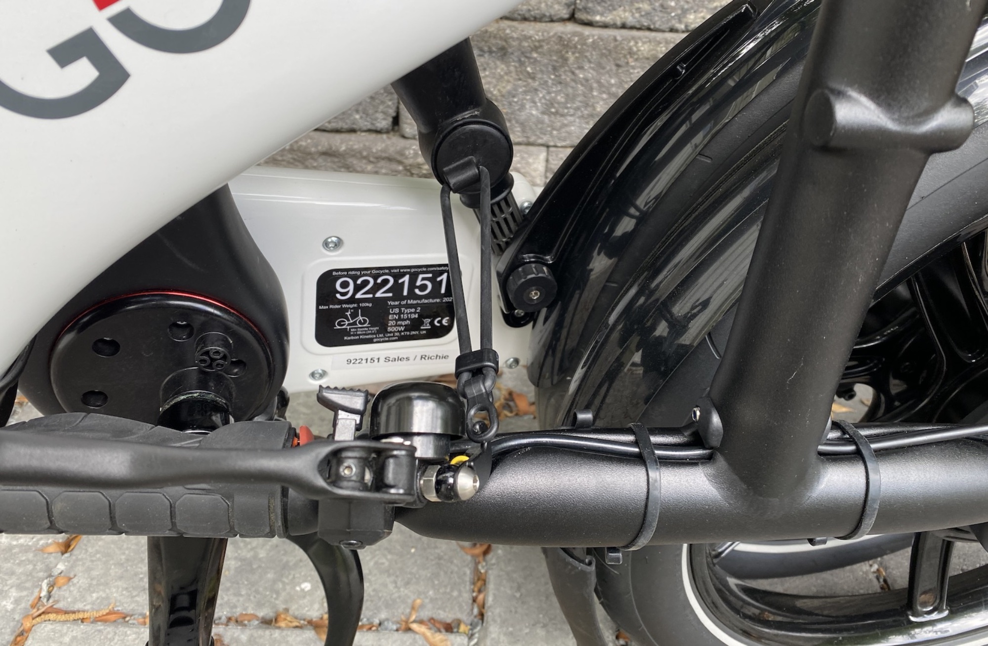 That same strap in use, holding the bike shut. Its location, both when stored and in use, was clearly thought through carefully.