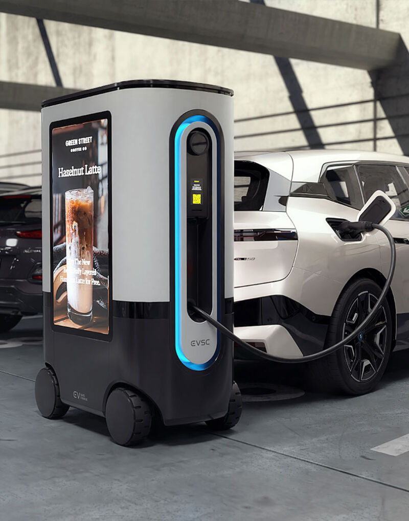 A mobile EV charger recharges a white BMW iX