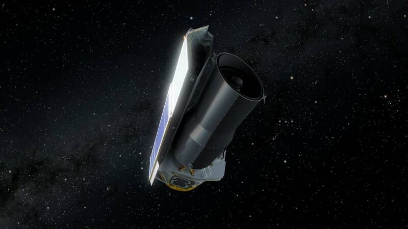 An artist's concept of NASA's Spitzer Space Telescope in deep space.