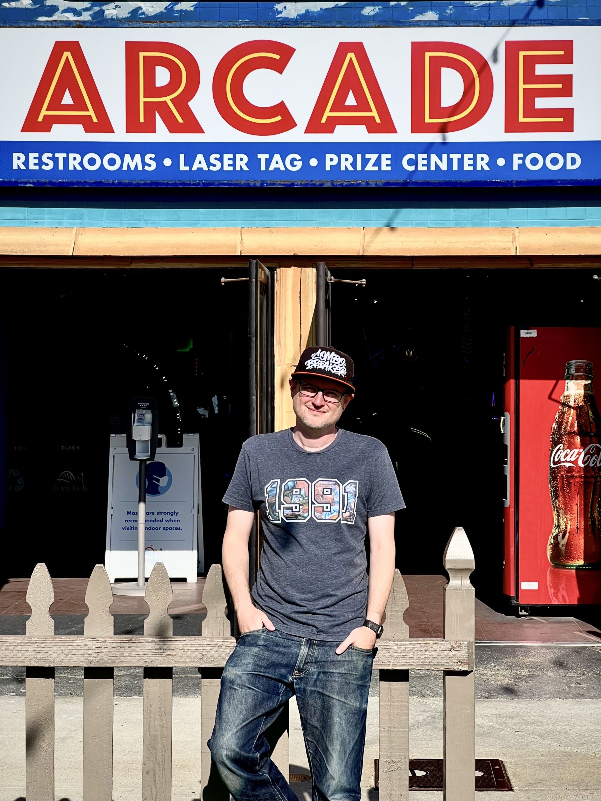 The author, circa 2022, in front of the arcade where he first played <em>Street Fighter</em> in 1991. Not quite the same, but it's still standing!