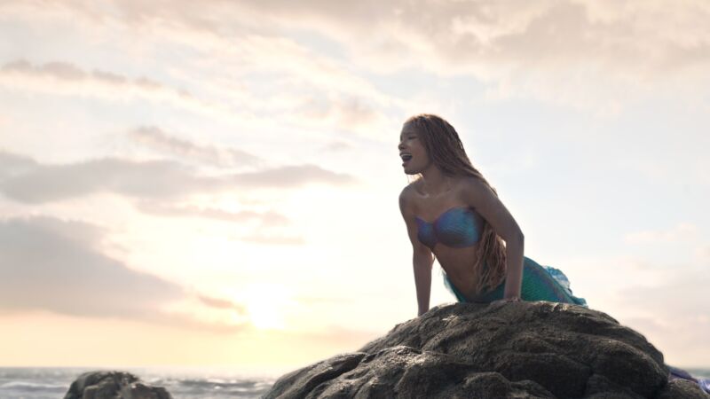 Disney's live-action little mermaid on a rock
