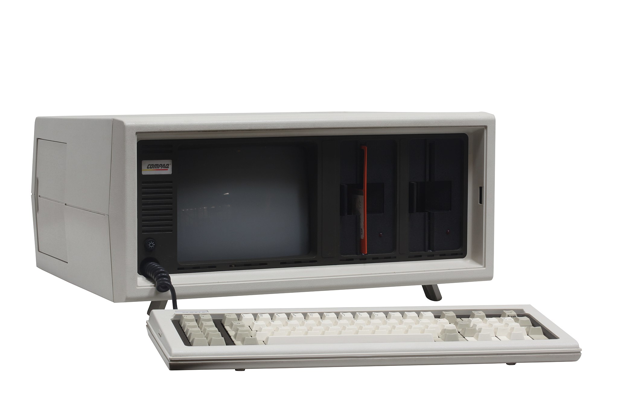 The Compaq Portable, an early IBM-compatible PC. These machines could run MS-DOS and the vast majority of IBM PC software, but you would occasionally run into software that accepts no substitutes.