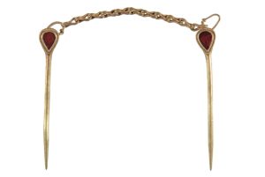 Gold and garnet pins from the burial