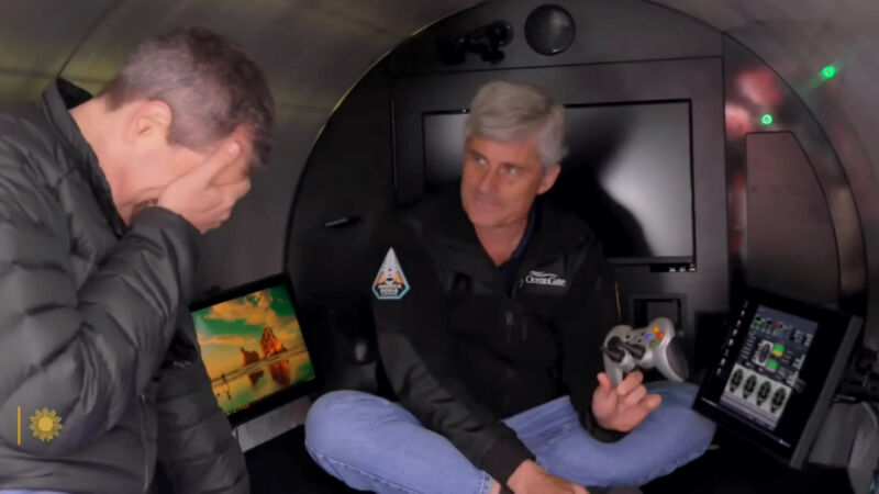 Stockton Rush shows David Pogue the game controller that pilots the OceanGate Titan sub during a CBS Sunday Morning segment broadcast in November 2022.
