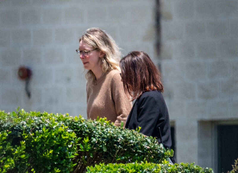 Elizabeth Holmes, founder of Theranos Inc., left, arrives at Federal Prison Camp Bryan in Bryan, Texas, US, on Tuesday, May 30, 2023.