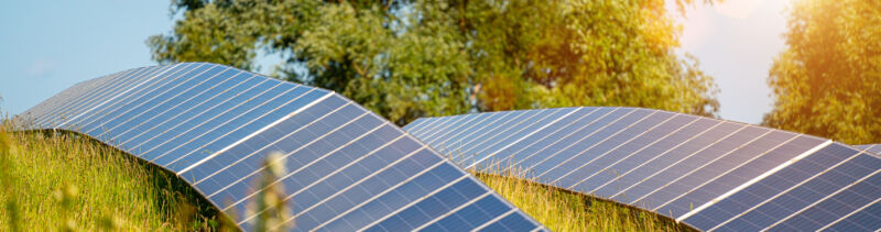 Images of rows of solar panels in a grassy area.