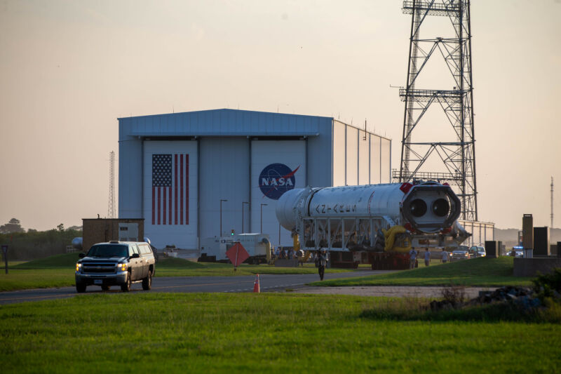 Northrop Grumman's Antares rocket rolls out of its hangar at Wallops Island, Virginia. Its two Russian engines are visible on the back of the first stage.
