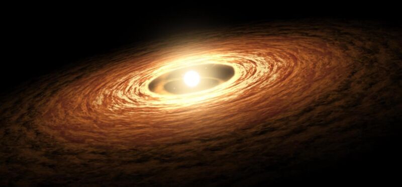 Image of a young star inside a disk of orange material