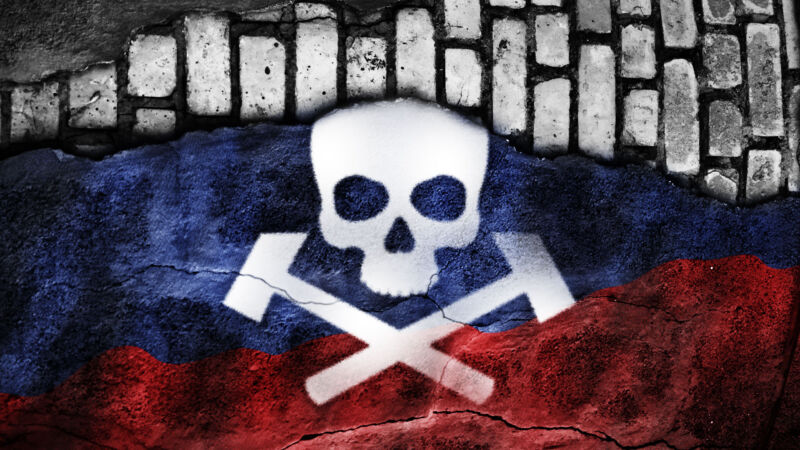 skull and crossed hammers on Russian flag on gray bricks