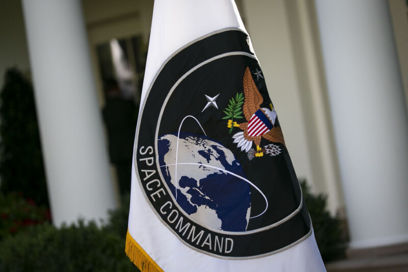A US Space Command flag is displayed outside the White House during a 2019 ceremony announcing the command's re-establishment.