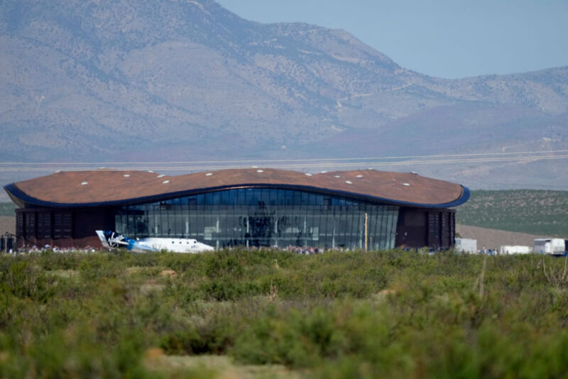 Virgin Galactic's VSS Unity is seen at Spaceport America in front of the company's iconic headquarters.