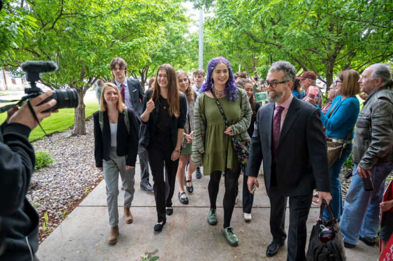 Youth plaintiffs are greeted by supporters as they arrive for the nation's first youth climate change trial at Montana's First Judicial District Court on June 12, 2023.