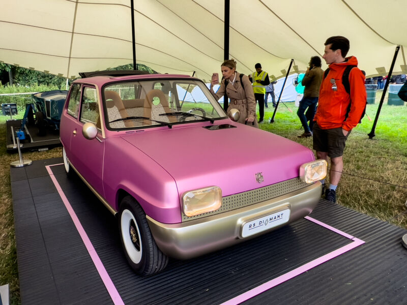 A pink Renault 5 EV concept under a tent at the Goodwood Festival of Speed