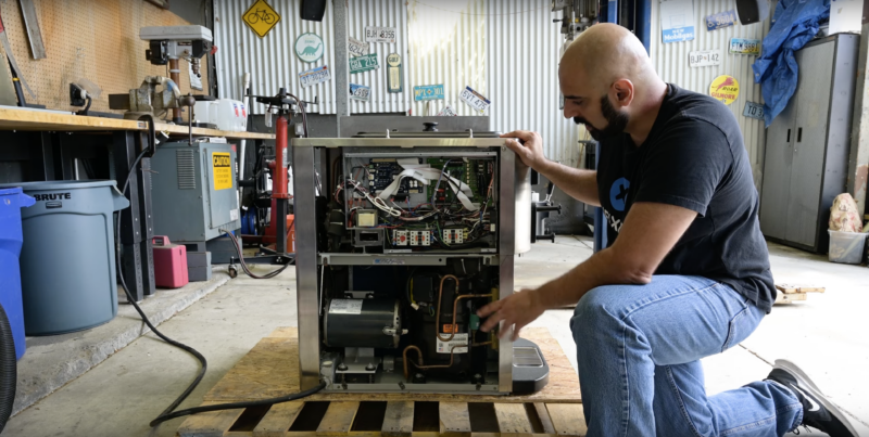 iFixit staff taking apart Taylor ice cream machine