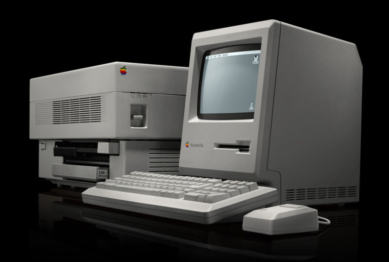 An Apple Macintosh Plus along with an original LaserWriter, the printer that helped popularize PostScript Type 1 fonts.
