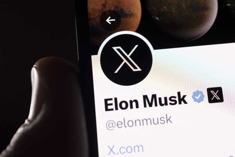 A smartphone displays Elon Musk's profile on X, the app formerly known as Twitter.